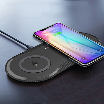 Wireless charging pad with a smartphone on a dark surface